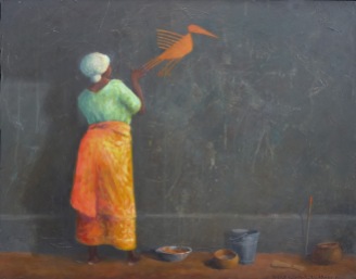 African woman painting a wall